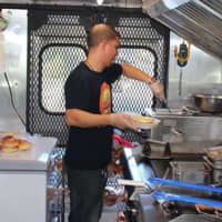 <p>Joe Defeis inside Sloppy Joe&#x27;s food truck.</p>