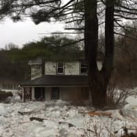 <p>A home was overcome and flooded with ice and water.</p>