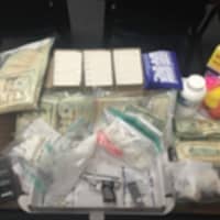 <p>Drugs, cash and a gun seized during the bust.</p>