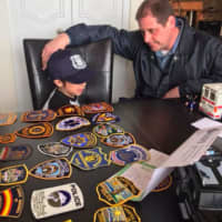 <p>Fair Lawn police officer Ian Manelis with Fort Lee&#x27;s Raphael.</p>