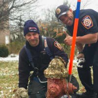<p>Anderson and fellow 2nd platoon firefighter maintain a hydrant.</p>