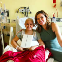 <p>WPLJ radio personality Jayde Donovan surprises Mya with an iPad at HUMC through her organization, Apple A Day, that brings devices to ailing youth.</p>