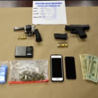 <p>Guns, drugs and cash seized during the bust.</p>