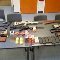<p>Seven handguns, six rifles, numerous high capacity magazines, ammunition, marijuana, and various firearm equipment were seized by police.</p>