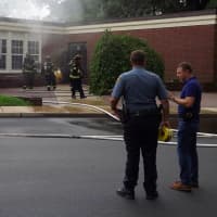 <p>Firefighters are working to determine the cause of a fire that heavily damaged at least one classroom on the first floor of a Ridgewood elementary school on Wednesday morning.</p>