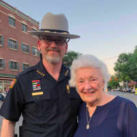 <p>Putnam County Sheriff Robert L. Langley Jr. with Maureen Durkin, who said she has been coming to the annual Brewster Fire Department Parade for the past 63 years.</p>
