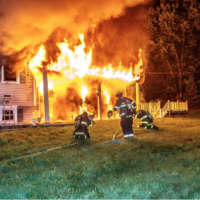 <p>Firefighters at the scene as the blaze rages in Wappinger.</p>