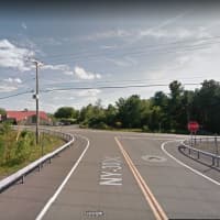 <p>A look at the intersection where the limousine ran through a stop sign and went through the parking lot of the country store (at left).</p>