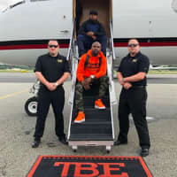 <p>Floyd Mayweather with rapper friend James &quot;P-Reala&quot; McNair and pilots.</p>