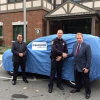 <p>Esurance Senior SIU Major Case Investigator Michael Sepanara (left) Esurance SIU Investigator
John Ferris (right.) Accepting the vehicle donation for the Scarsdale Police Department is Officer Michael Coyne (center).</p>