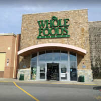 <p>A 23-year-old woman had her car stolen at gunpoint at Whole Foods in Lake Grove.</p>