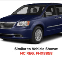 <p>A 2004 blue Chrysler Town and Country minivan.</p>
