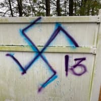 <p>Lakewood Scoop posted this photo of anti-Semitic graffiti sprayed on a fence behind a business in Jackson.</p>