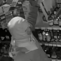 <p>Three men are at large after breaking into a Smithtown liquor store with a baseball bat.</p>
