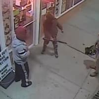 <p>Three men are at large after breaking into a Smithtown liquor store with a baseball bat.</p>