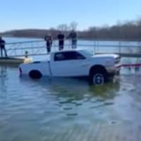 <p>Emergency crews helped tow a pickup truck out of a Howell reservoir.</p>