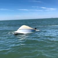 <p>A look at the overturned boat.</p>