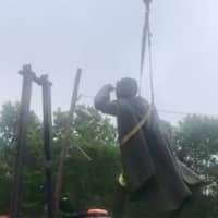 <p>A 60-year-old statue of Christopher Columbus being removed Wednesday by a Trenton public works crew.</p>