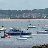 <p>NJSP marine units, NYPD Harbor unit and U.S. Coast Guard were assisted by dozens of private sailors to search for two people lost in Raritan Bay. A 30-year-old was rescued but a teenager remained missing late Thursday. (Photo: Perth Amboy Now)</p>