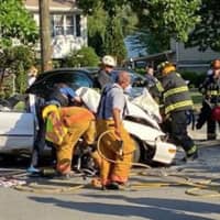 <p>The sedan driver was conscious and alert after being extricated, and was taken to the hospital with unknown injuries. The minivan driver was sitting in a chair on the side of the road waiting to be transported.</p>