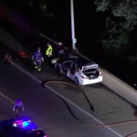 <p>A car burst into flames on Wednesday night along I-295 in Hamilton Township. (Chopper6 ABC News Philly)</p>