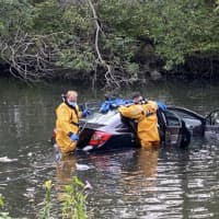 <p>A motorist had to be rescued in Stamford after crashing into the Rippowam River.</p>