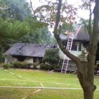 <p>Heavy smoke was seen billowing from the home’s front door as rescue crews arrived, and the second alarm was struck just before 11:15, authorities said.</p>