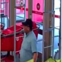 <p>A photo of the credit card thief entering the Commack Target, where he used the stolen credit cards to make purchases.</p>