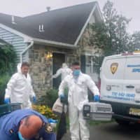 <p>Monmouth County Animals in Crisis Officers outside a vacant home where 30 cats were rescued.</p>