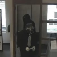 <p>The New Canaan Police Department released new photos of suspects implicated in a bank robbery.</p>