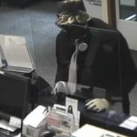 <p>The New Canaan Police Department released new photos of suspects implicated in a bank robbery.</p>