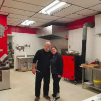 <p>Alicia and Desi Dutcher togther in the kitchen of Legal Swine BBQ</p>