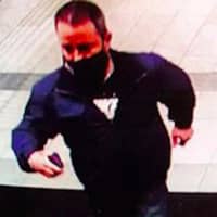 <p>A surveillance image of the wanted man</p>