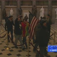 <p>Rioters in the rotunda of the Capitol.</p>