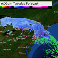 <p>A National Weather Service projection for the storm system at 6 p.m. Tuesday, Jan. 26, showing areas expected to see snow (blue), a wintry mix (pink), and rain (green).</p>