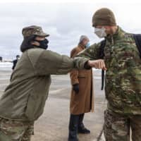 <p>U.S. Army Col. Lisa J. Hou, state Adjutant General and Commissioner of the New Jersey Department of Military and Veterans Affairs, greets Airmen during the return of 108th Wing and 177th Fighter Wing members to New Jersey on Wednesday.</p>