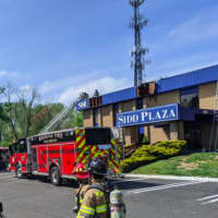 <p>Millstone firefighters battle a commercial roof fire.</p>