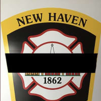 <p>A New Haven firefighter was killed and three others injured, one critically, battling a house fire.</p>