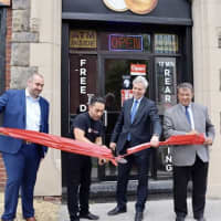 <p>White Plains Mayor Thomas Roach, Westchester County Executive George Latimer, and Bagels &amp; Deli Express owner Anthony Barona at the grand opening of the new shop.</p>