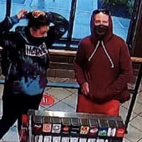 <p>Police released surveillance photos of suspects who allegedly stole a car from Chick-Fil-A in Farmingdale.</p>