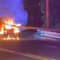 <p>A car driven by an 18-year-old man from Brick caught fire late Saturday after riding atop the guardrail (at right) and then toppling a utility pole and power lines. (Photo courtesy of The Lakewood Scoop)</p>