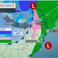 <p>A look at areas expected to see rain (green) and snow showers (pink) during the height of the storm on Monday, Nov. 22.</p>