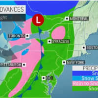 <p>A look at areas in the Northeast where showers (green) and snow showers (pink) are expected on Thanksgiving night on Thursday, Nov. 25.</p>