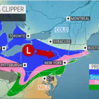 <p>A look at areas expected to see a mix of rain and snow (in pink), snow showers (light blue), and snow (blue) from an Alberta Clipper system on Sunday, Nov. 28.</p>