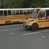 <p>School buses lined up at C.D. Hylton High School.</p>