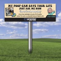 <p>Herbie Allen&#x27;s billboard promoting &quot;perfect poop.&quot;</p>