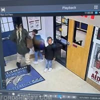 <p>Riley and Regan Crowder being taken from the school.</p>