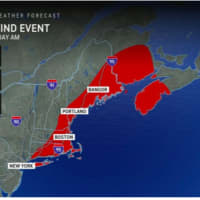 <p>A look at areas (in red) where wind gusts over 50 miles per hour or more are expected, leading to scattered power outages.</p>