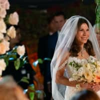 <p>Theresa Nist, of Shrewsbury, walks down the aisle at the Golden Wedding to marry Gerry Turner.</p>