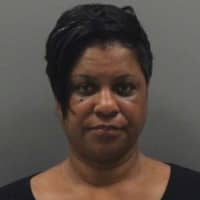 <p>Shakela Holley has been arrested for helping the suspect in a double-homicide investigation stay on the run.</p>